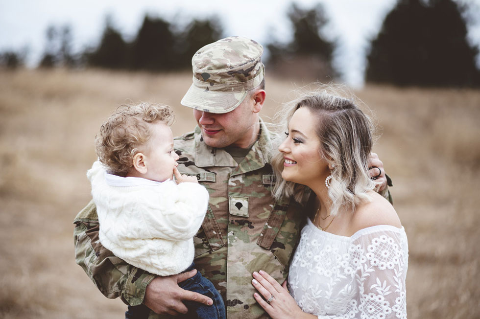 Military personnel with wife and child