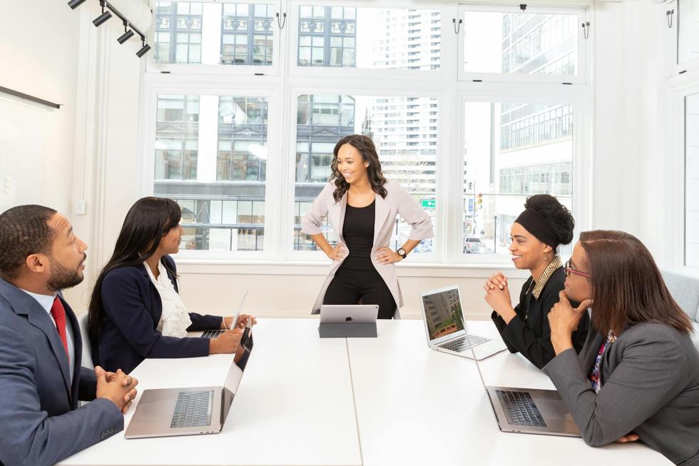 employees around a table meeting