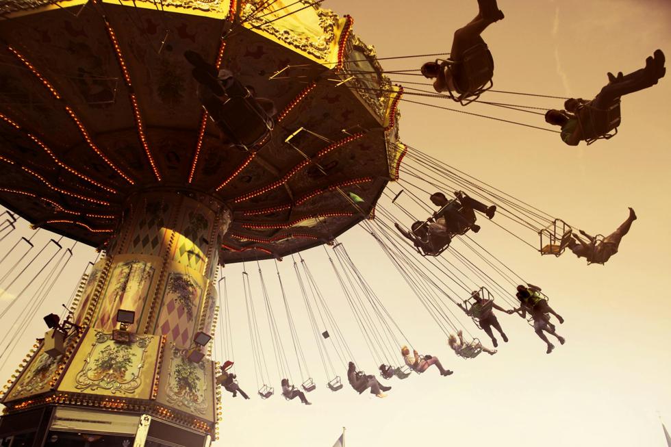 theme park swing ride at dusk